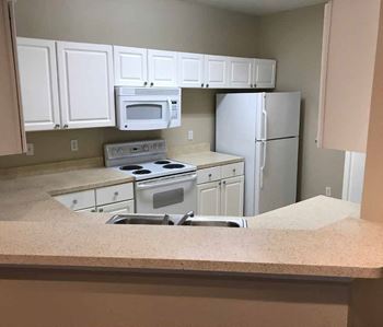 Kitchen with white cabinetry